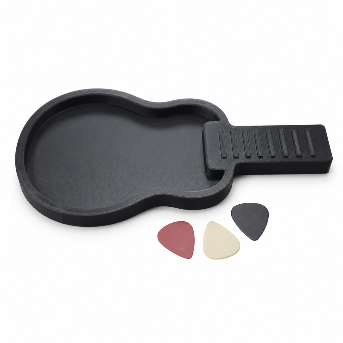 Black Papaw acoustic-guitar-shaped pick holder with three display guitar picks on a white background