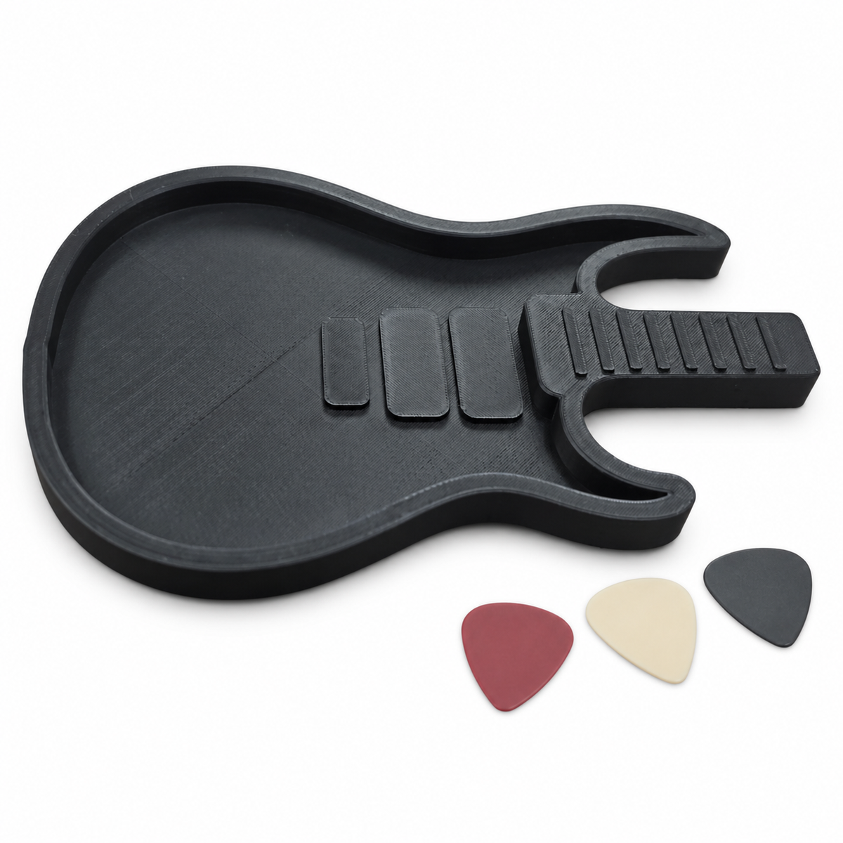 Black Richard electric-guitar-shaped pick holder with three display guitar picks on a white background